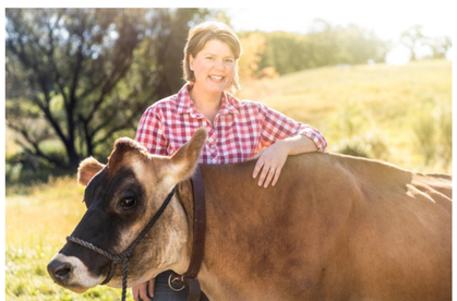 Picture of Inga Witscher with a cow.